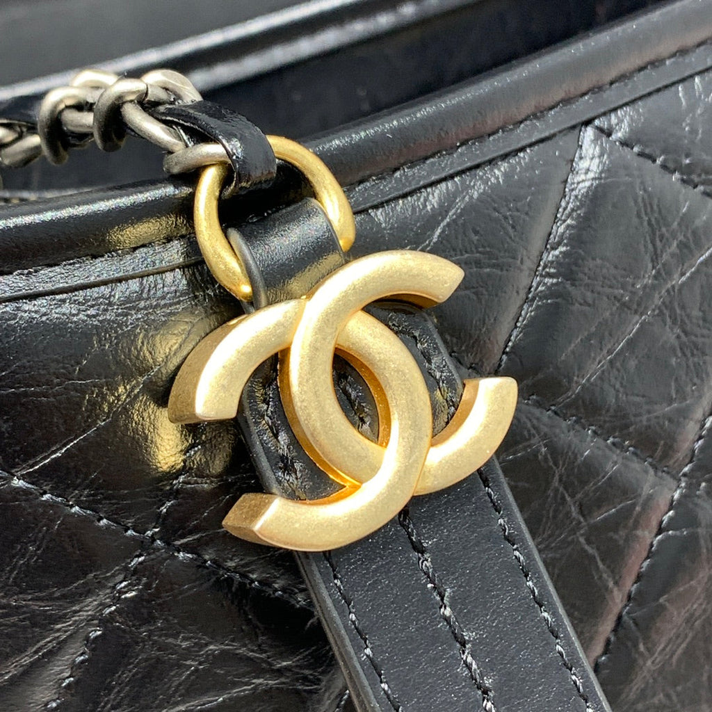 CHANEL HOBO BAG 25 WITH STRAP IN BLACK CALFSKIN GOLD AND SILVER HARDWARE