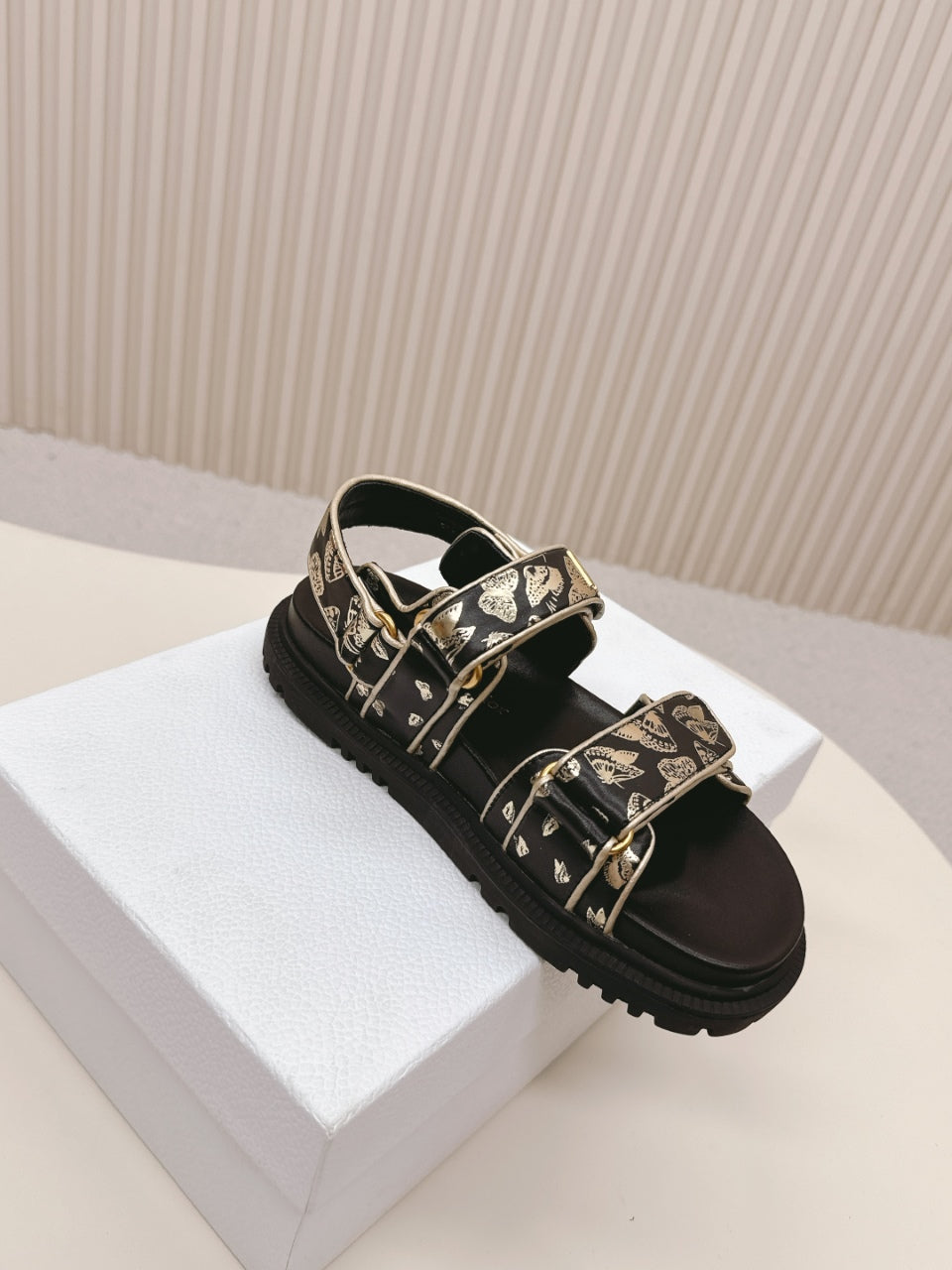 DIOR BACK-STRAP SANDALS 25S IN BLACK AND GOLD CALFSKIN WITH BUTTERFLY MOTIF